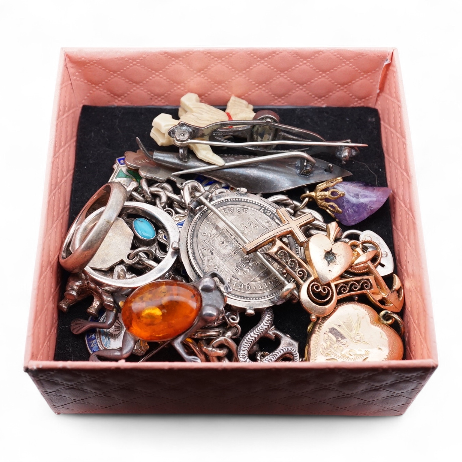A small group of sterling, white metal and and other jewellery, including a charm bracelet, frog brooch, etc.